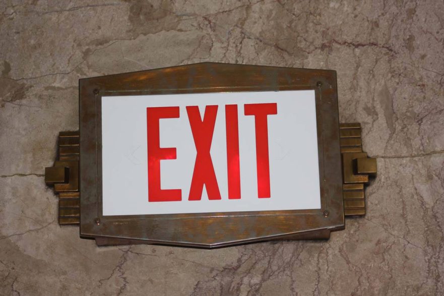 Exit sign, located in the main lobby, is done in bronze and displays Art Deco details.