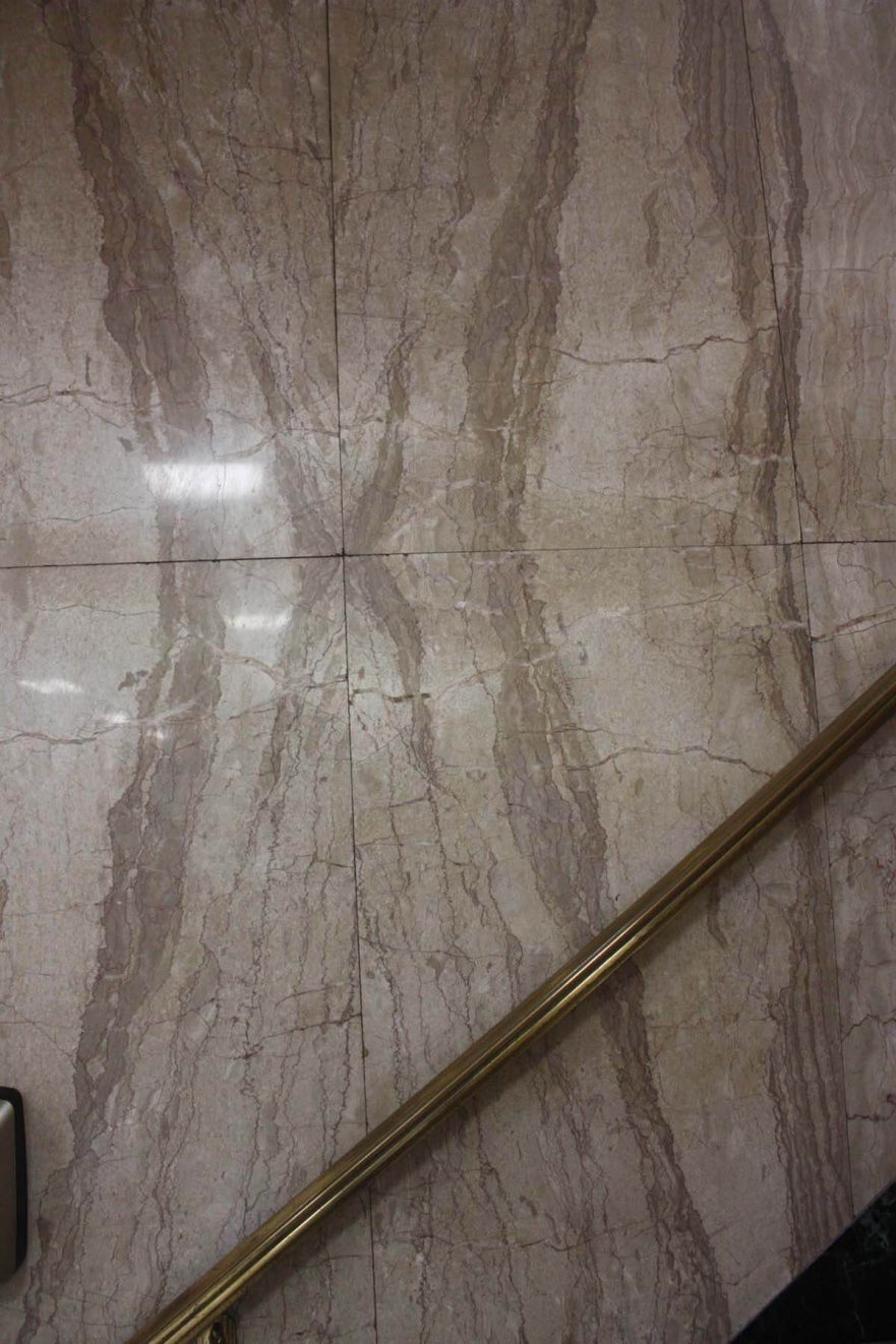 Booked marble on wall in stairwell. Note that the design does not only fold left to right but also up and down.