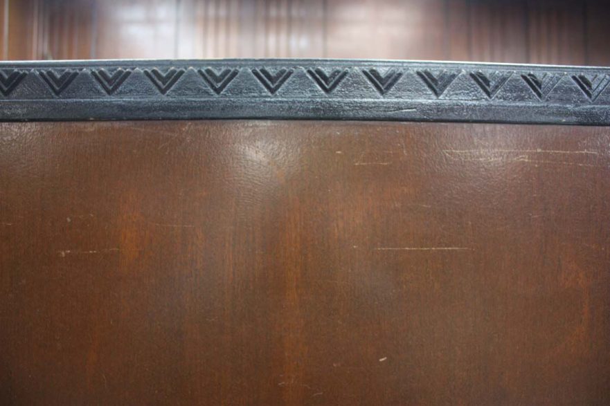 Chevron pattern adorning the bar and judges bench in the courtroom.