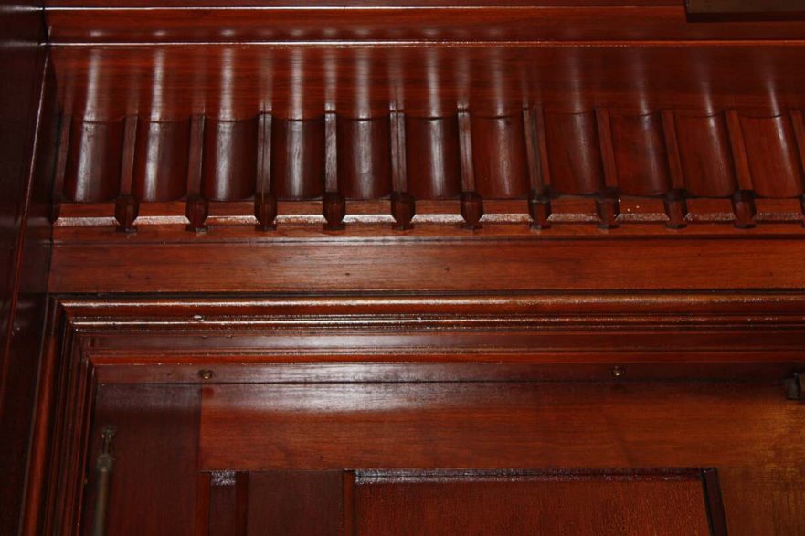 Carved original detail above the main door to the courtroom.
