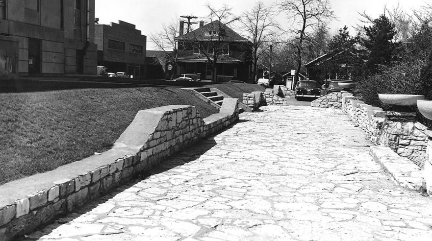 Flagstone walk, retaining walls and urns, circa 1960.
